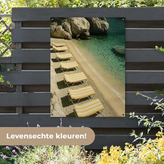 Tuinposter 90x120 cm - Tuindecoratie Strandbedden - Zee - Stenen - Baai - Poster voor in de tuin - Buiten decoratie - Schutting tuinschilderij - Tuindoek muurdecoratie - Wanddecoratie balkondoek