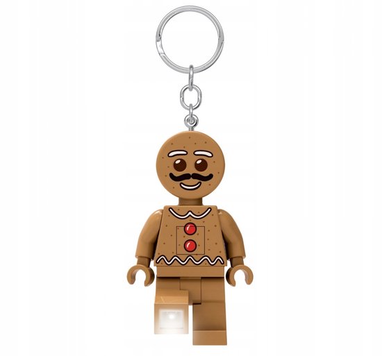 Peperkoekman sleutelhanger met lichtje in één been. Bruine kleur, witte versieringen en rode knopen.