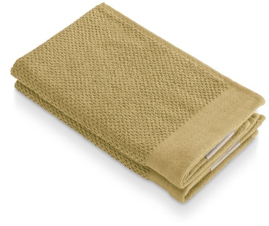 Gele Walra gastendoek van zacht katoen met popcorntextuur, gevouwen.