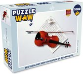 Puzzel Een viool met een strijkstok op bladmuziek - Legpuzzel - Puzzel 1000 stukjes volwassenen