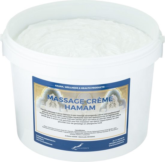 Witte massagecrème in een emmer met een blauw en goudkleurig label met de tekst 'MASSAGE CRÈME HAMAM' en ingrediëntenlijst.