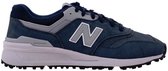 Chaussure de golf New Balance bleu marine avec logo N gris et semelle blanche, vue de côté.