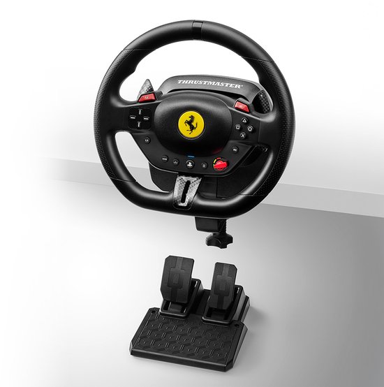 Zwarte race wheel met Ferrari-logo en pedalen, losse onderdelen.