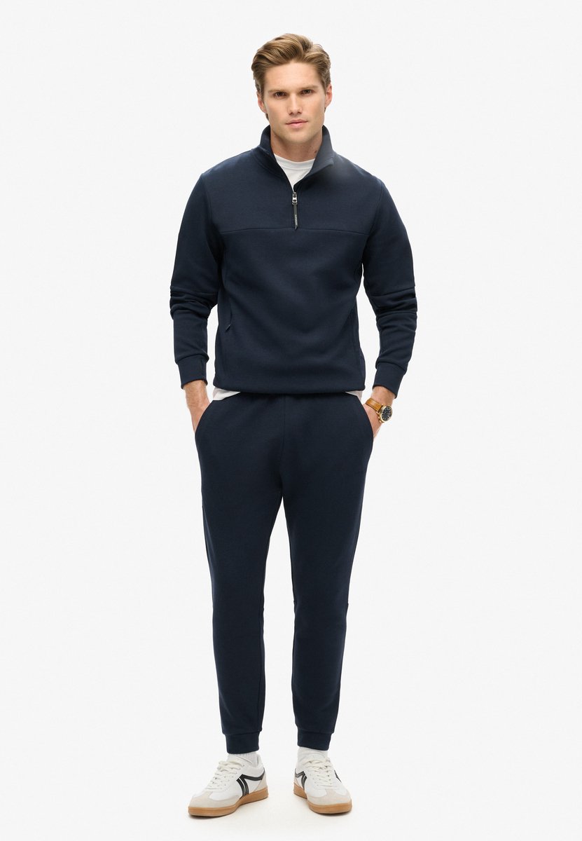 Superdry Tech joggingbroek met taps toelopende pijpen Heren Broeken Blauw