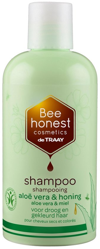 Lichtgroene fles shampoo met honing en aloë vera logo. Tekst: shampoo aloë vera & honing.