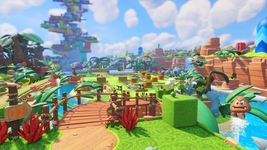 Gameplay van Mario + Rabbids Kingdom Battle met een tropische omgeving, een houten brug en waterpartijen, met Mario en Rabbid Peach in de voorgrond.