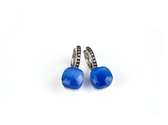 Zilveren oorringen oorbellen model pomellato gezet met felblauwe steen