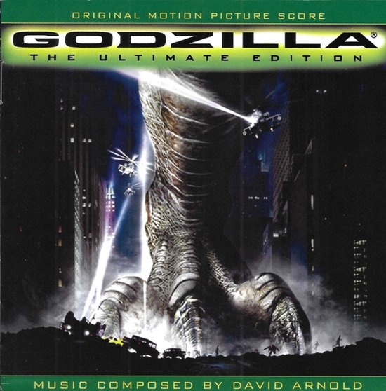 De klauw van Godzilla verplettert voertuigen in een nachtelijke stad, met helikopters die eromheen cirkelen. "Godzilla: The Ultimate Edition", muziek van David Arnold.