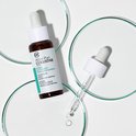 Collistar Attivi Puri Glycolic Acid peeling fles op petrischaal, met druppelaar.