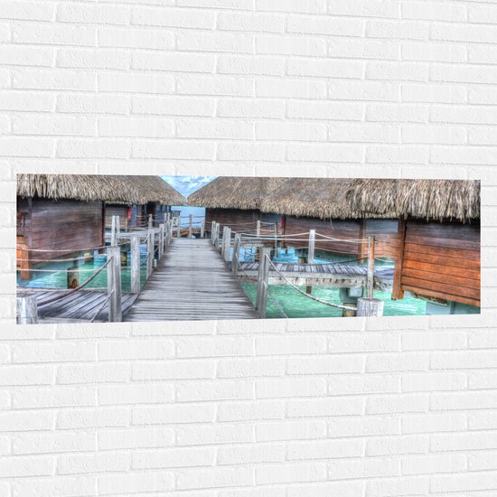 WallClassics - Muursticker - Strandhuisjes Bora Bora - 150x50 cm Foto op Muursticker