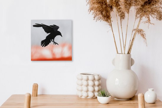 Un corbeau aux ailes déployées en l'air 20x20 cm - petit - Tirage photo sur toile (Décoration murale salon / chambre)