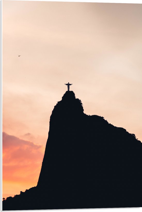 WallClassics - PVC Schuimplaat- Silhouet van Jezusbeeld op berg met Zonsondergang - 50x75 cm Foto op PVC Schuimplaat
