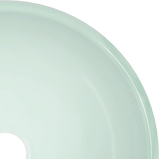 Lavabo rond vert clair.