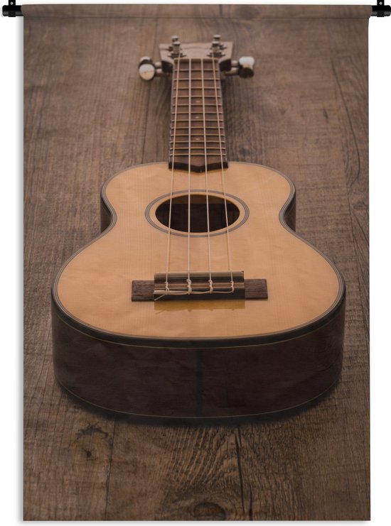 Wandkleed Akoestische gitaar - Akoestische gitaar op een houten tafel Wandkleed katoen 90x135 cm - Wandtapijt met foto