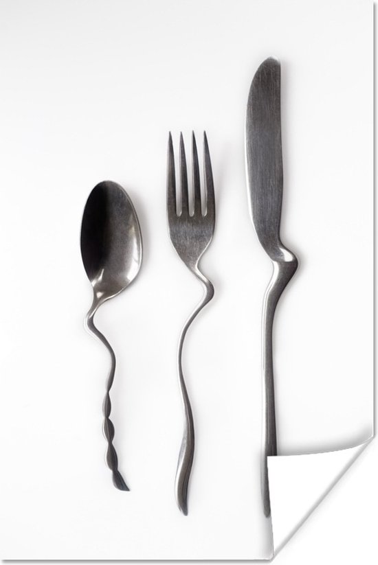 Verbogen lepel vork en mes Het verbogen zilveren bestek wordt afgezet tegen... | bol.com