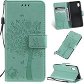 Tree & Cat Pattern Pressed Printing Horizontale Flip PU lederen tas met houder & kaartsleuven & portemonnee & lanyard voor Galaxy A10e (groen)