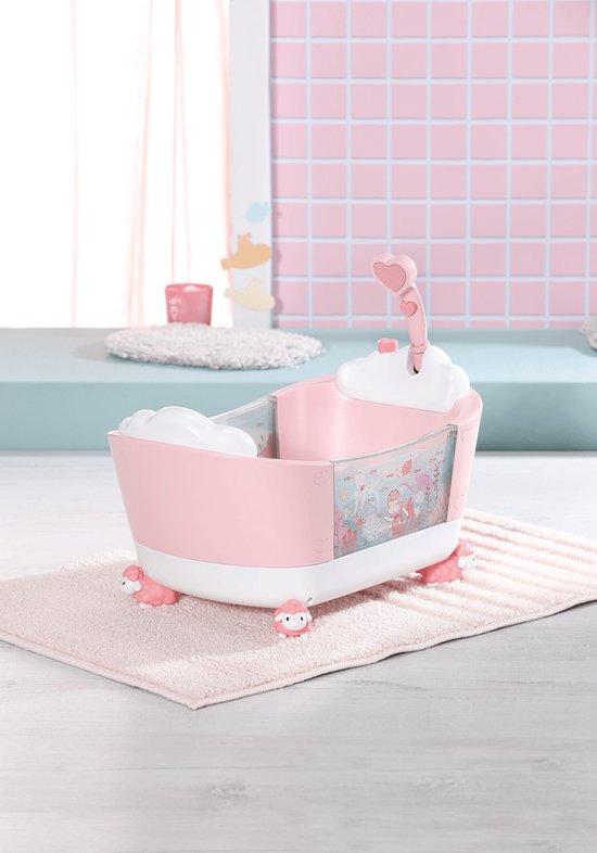 Roze babybadje met witte schaapjesvoetjes, douchekop en transparante zijwanden met zeedieren.