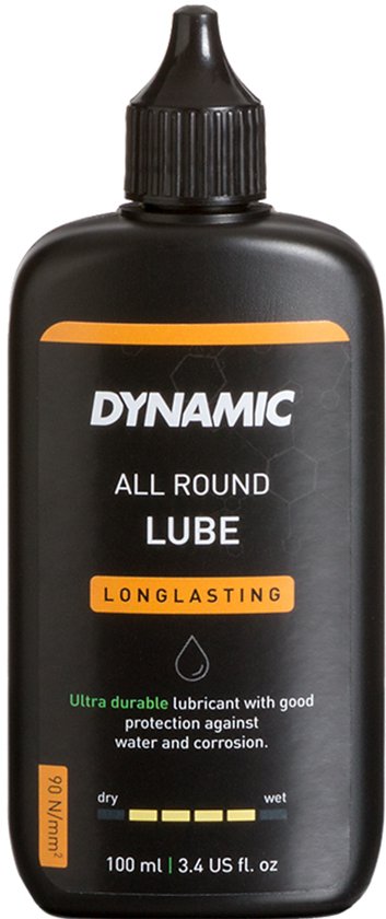 Zwarte fles Dynamic All Round Lube 100ml met oranje label en witte tekst. Smeermiddel met bescherming tegen water en corrosie.