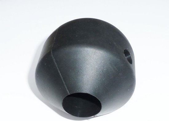 Een ovale, zwarte, kunststof dop met twee gaten voor een paddle steel.