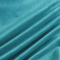 Gladde, turquoise fluwelen stof met golvende plooien.