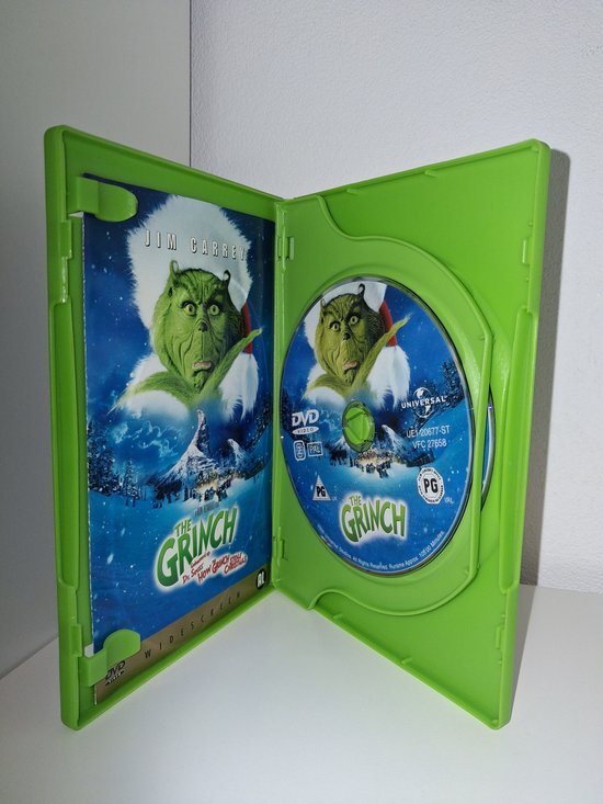 Open groene DVD-hoes met de "The Grinch" DVD en de hoes.