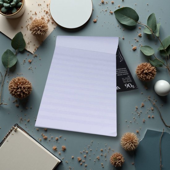 Aurora muziekpapierblok met notenbalken, omringd door decoratieve elementen.