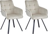 Twee beige fluwelen eetkamerstoelen met armleuningen en matzwarte spinpoten.