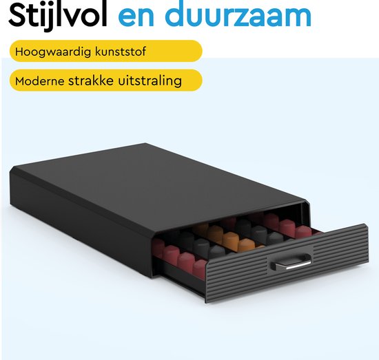Boîte noire pour capsules, tiroir ouvert rempli de capsules Nespresso rouges, marron et noires.