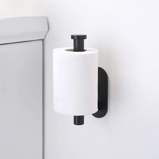 Porte-rouleau toilette noir avec papier toilette à côté de toilettes.