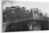 Schilderij - Brug over het kanaal in Amsterdam — 90x60 cm
