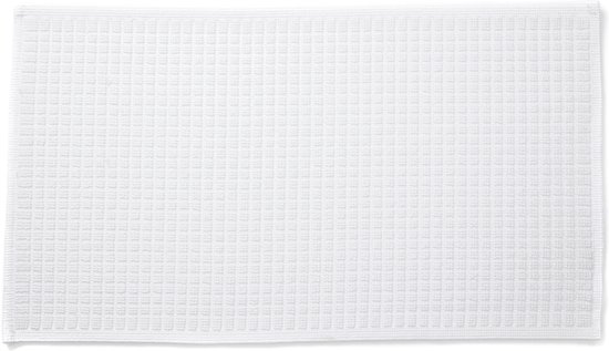 Witte badmat met een fijne wafelstructuur.