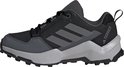 Zwarte wandelschoen voor kinderen met grijze Adidas strepen en Terrex logo op de hak.