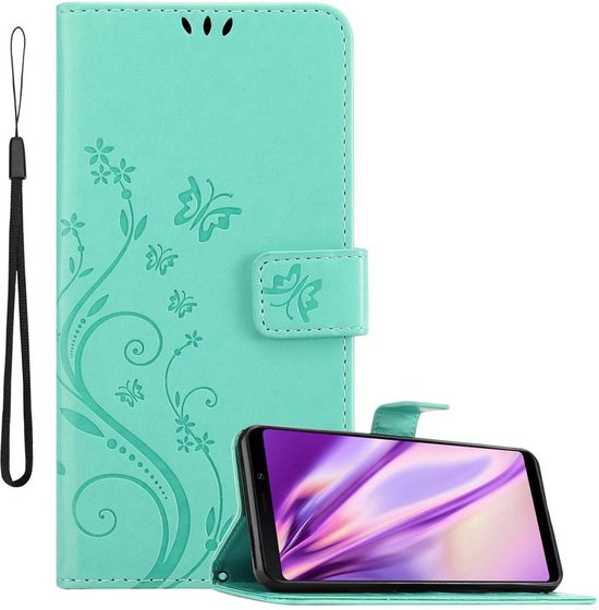 Coque de téléphone turquoise à motif floral, dragonne et téléphone en position debout.