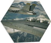 WallClassics - PVC Schuimplaat Hexagon - Twee Vliegtuigen boven Bergen en Wolken - 60x52.2 cm Foto op Hexagon (Met Ophangsysteem)