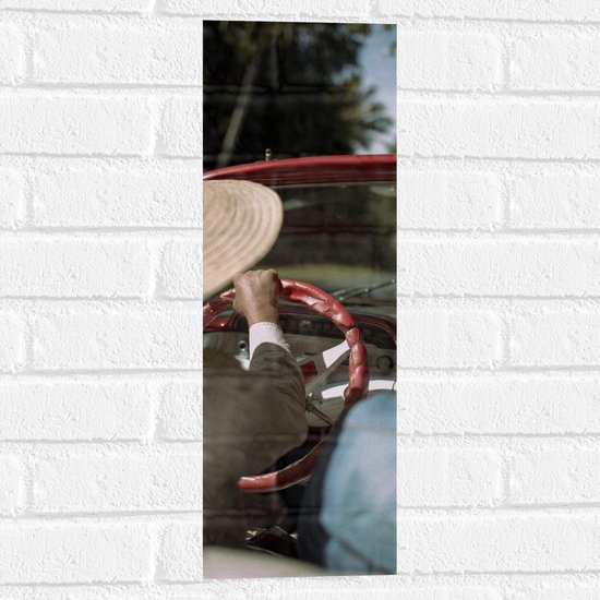 WallClassics - Muursticker - Persoon achter rood Stuur - 20x60 cm Foto op Muursticker