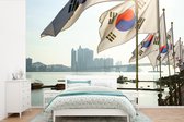 Behang - Fotobehang Zuid-Koreaanse vlaggen in de haven van Busan - Breedte 330 cm x hoogte 220 cm