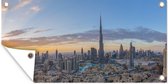 Muurdecoratie Kleurrijke lucht boven Dubai en de Burj Khalifa - 180x120 cm - Tuinposter - Tuindoek - Buitenposter
