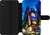 Bookcase Geschikt voor iPhone XS telefoonhoesje - New York - Nacht - USA - Met vakjes - Wallet case met magneetsluiting