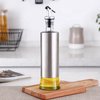 foto van BooGoo® - RVS Oliefles Deluxe - Oliefles met Schenktuit en Accessoires - Olijfolie fles - Olie fles glas - Kerstcadeau - Voor Mannen - Vrouwen - Kerst Cadeau