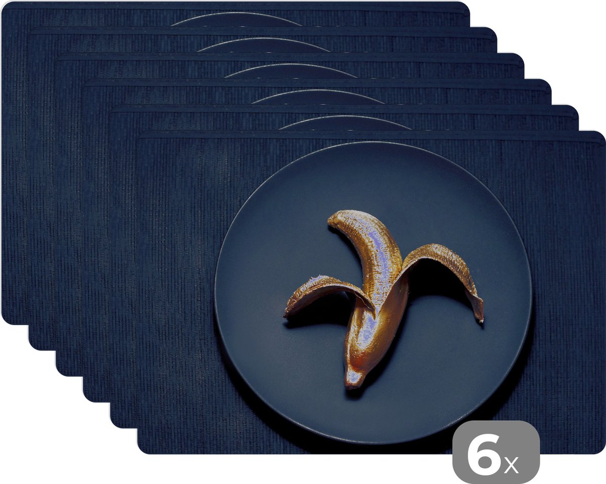 Placemat - Placemats kunststof - Gouden banaan op een donkere achtergrond - 45x30 cm - 6 stuks - Hittebestendig - Anti-Slip - Onderlegger - Afneembaar