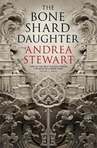 Boekomslag van 'The Bone Shard Daughter' door Andrea Stewart, met sierlijke, Aziatische architectuur en de titel in rode en zwarte letters.