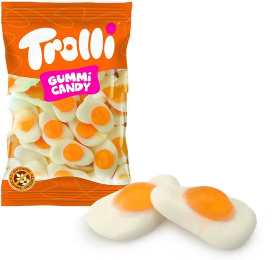 Oranje verpakking van Trolli gummi snoep, met ernaast twee eivormige snoepjes.