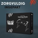 Doos van een zwarte game bureau met "FOR THE WIN" logo. "ZORGVULDIG INGEPAKT" tekst.
