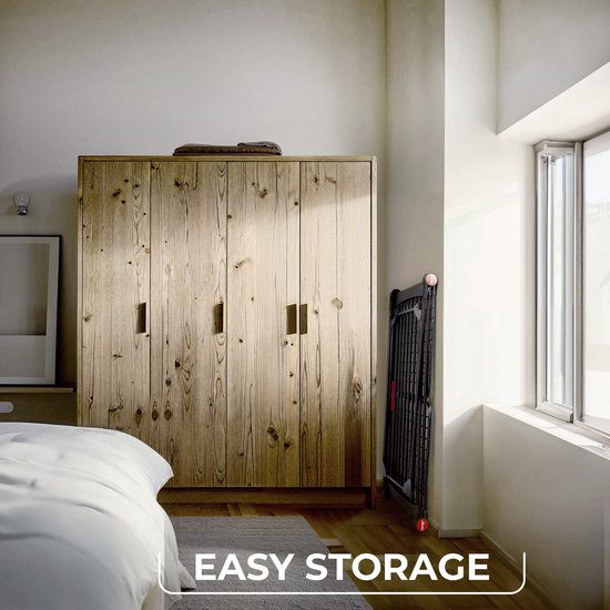 Zwart Vileda Infinity Flex droogrek, ingeklapt voor "easy storage" in een slaapkamer.