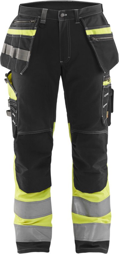 Pantalon de travail noir avec de nombreuses poches, des détails jaune fluo, des bandes réfléchissantes et des coutures blanches.