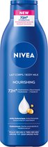 NIVEA Verzorgende Body Milk - met Hyaluronzuur Zachte Amandel Olie en Voedend serum - Body Melk met 72 Uur Hydratatie - Voor Droge tot Zeer Droge Huid - 250 ml