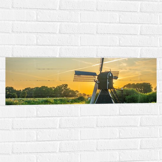 Muursticker - Windmolen in Weide met Zonsondergang - 90x30 cm Foto op Muursticker