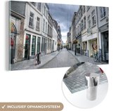 MuchoWow® Glasschilderij 120x60 cm - Schilderij acrylglas - Architectuur - Maastricht - Wit - Foto op glas - Schilderijen