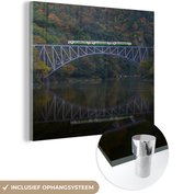 MuchoWow® Glasschilderij 20x20 cm - Schilderij acrylglas - Een spoorbrug over het water - Foto op glas - Schilderijen