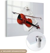 MuchoWow® Peinture sur verre 120x90 cm - Peinture sur verre acrylique - Un violon avec un archet sur une partition - Photo sur verre - Peintures